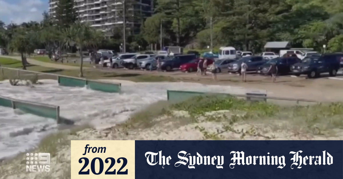 Video Queensland king tides sweep shipping container, several kegs of